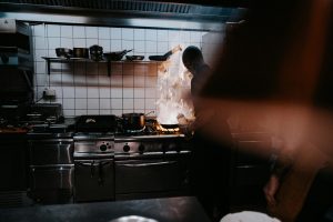 a stove top oven sitting inside of a kitchen