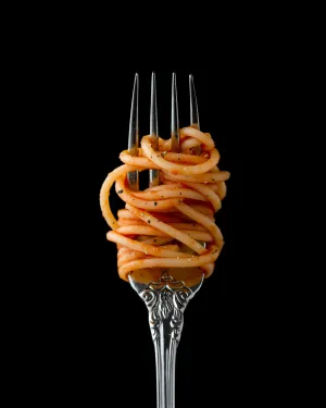 a fork with pasta on it