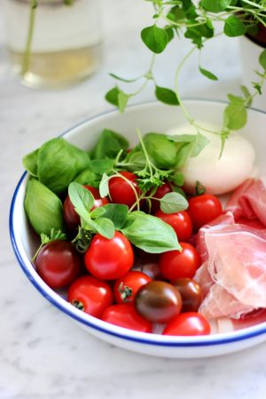 a bowl of fruit on a plate