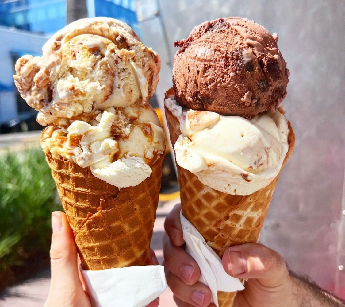 "cheers-ing" with two ice cream cones