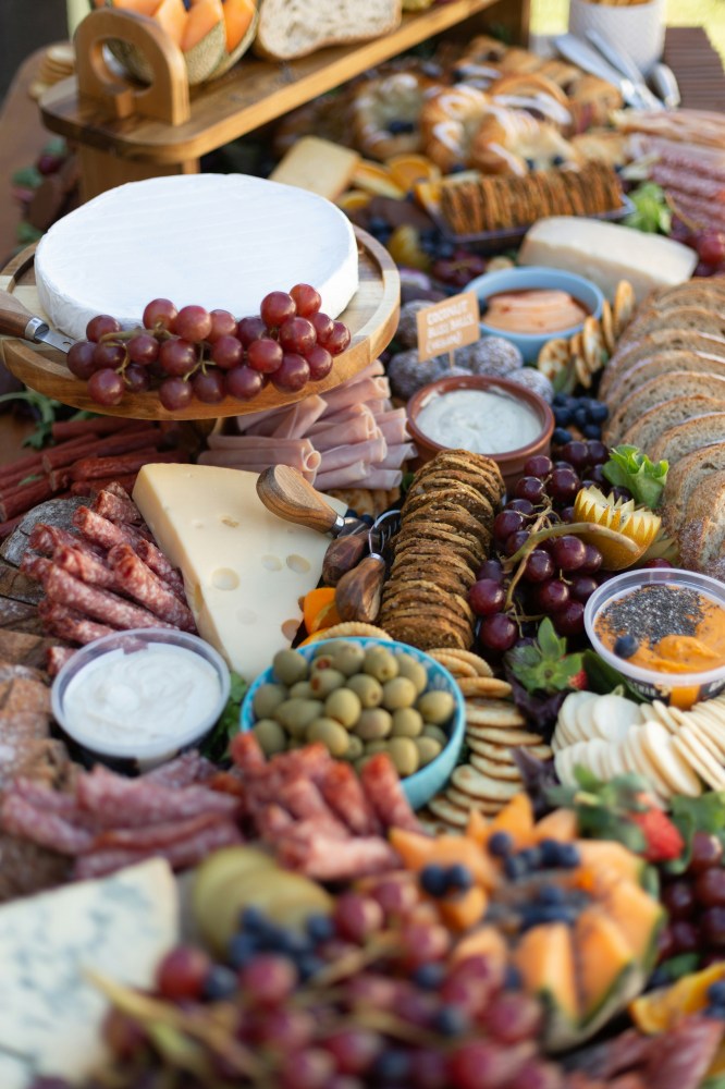 a table full of food for a charcuterie board display