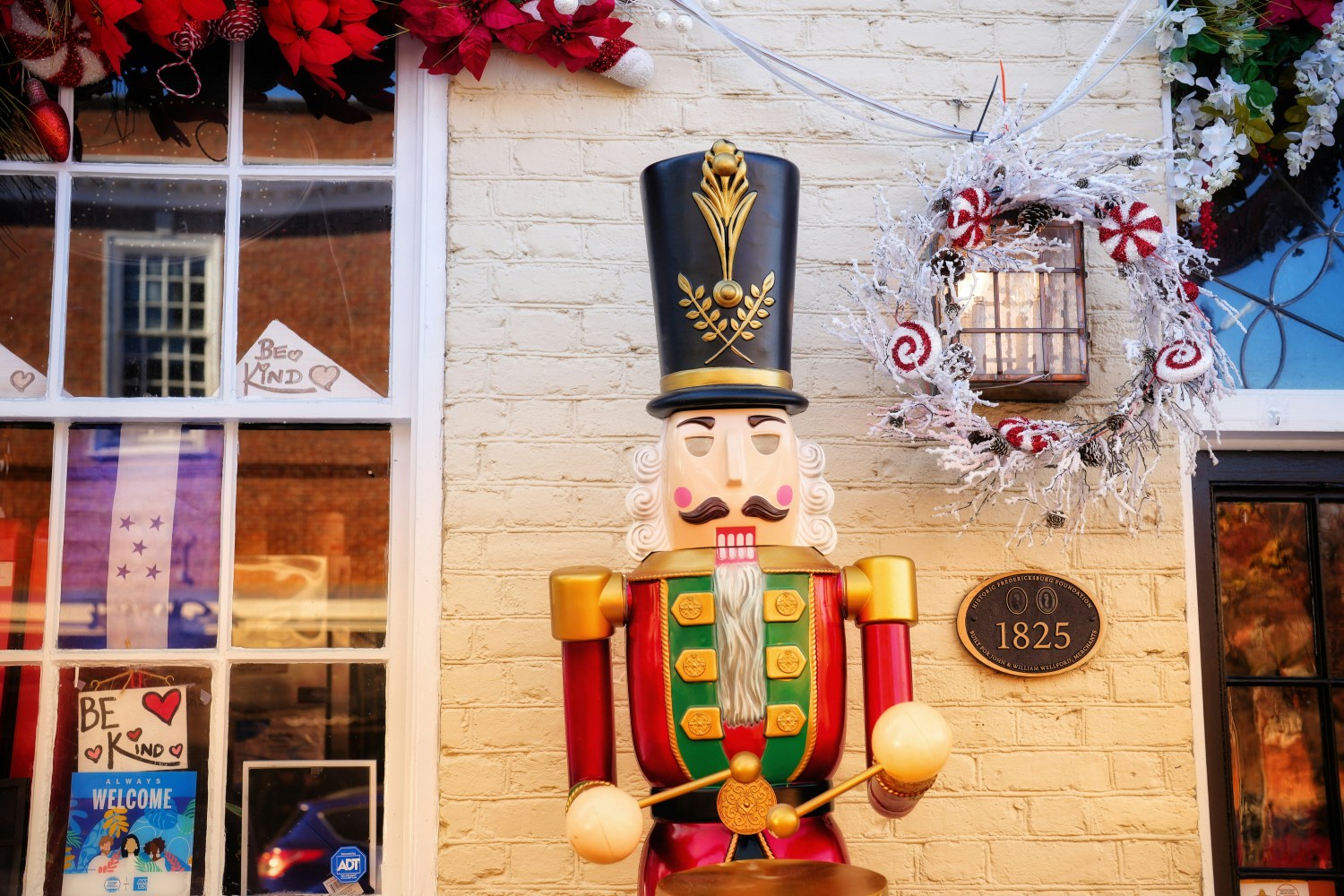 Nutcracker in front of a decorated home