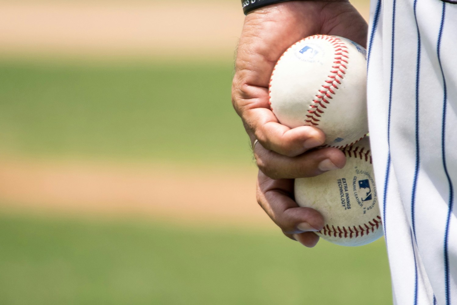 a person holding a baseball bat at a ball