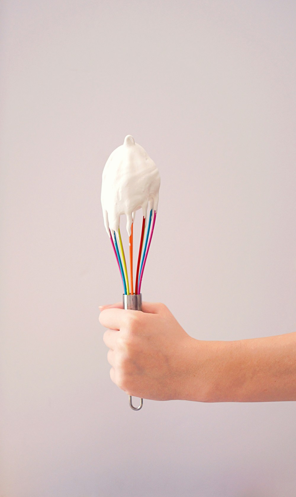 a hand holding a toothbrush