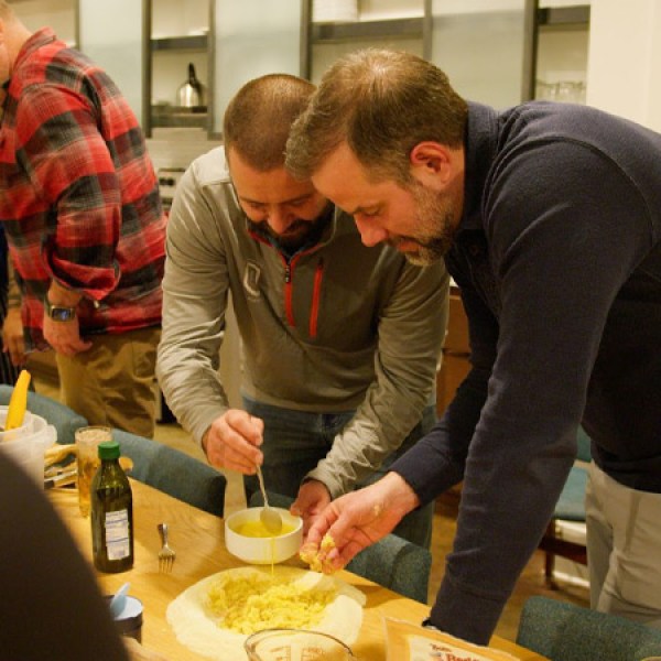 a man cutting a cake