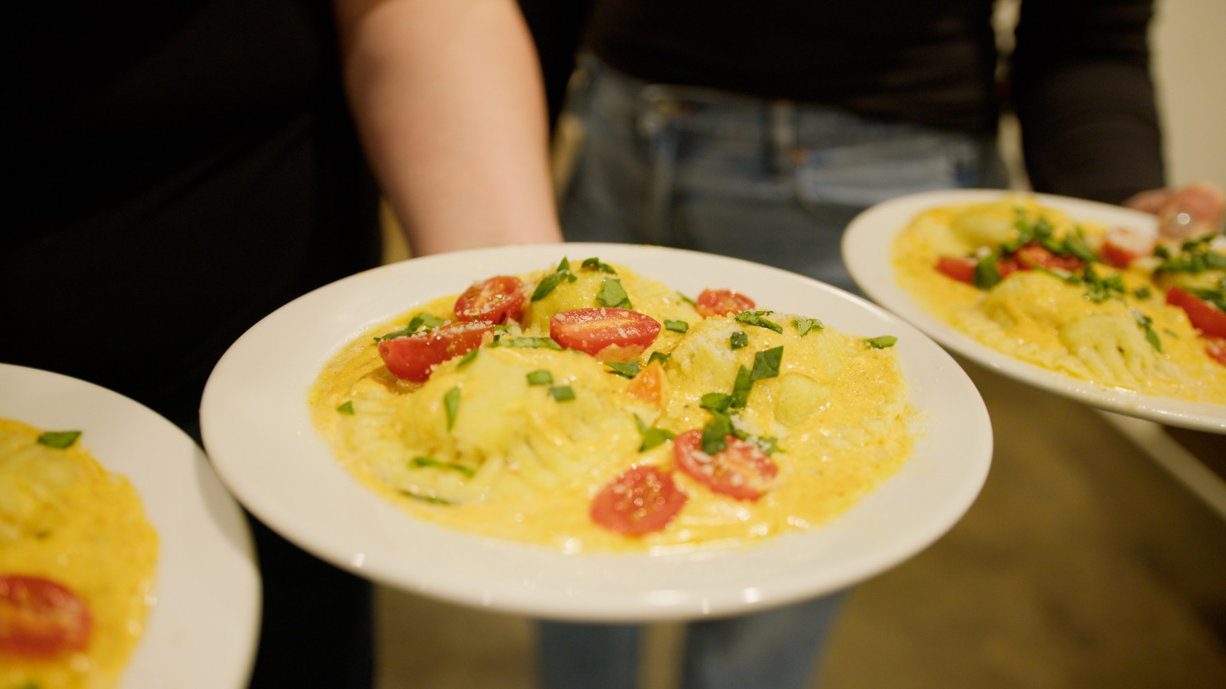 A plate of delicious pasta made by a group cooking class in New York.