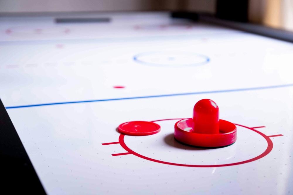 a close up of an air hockey table