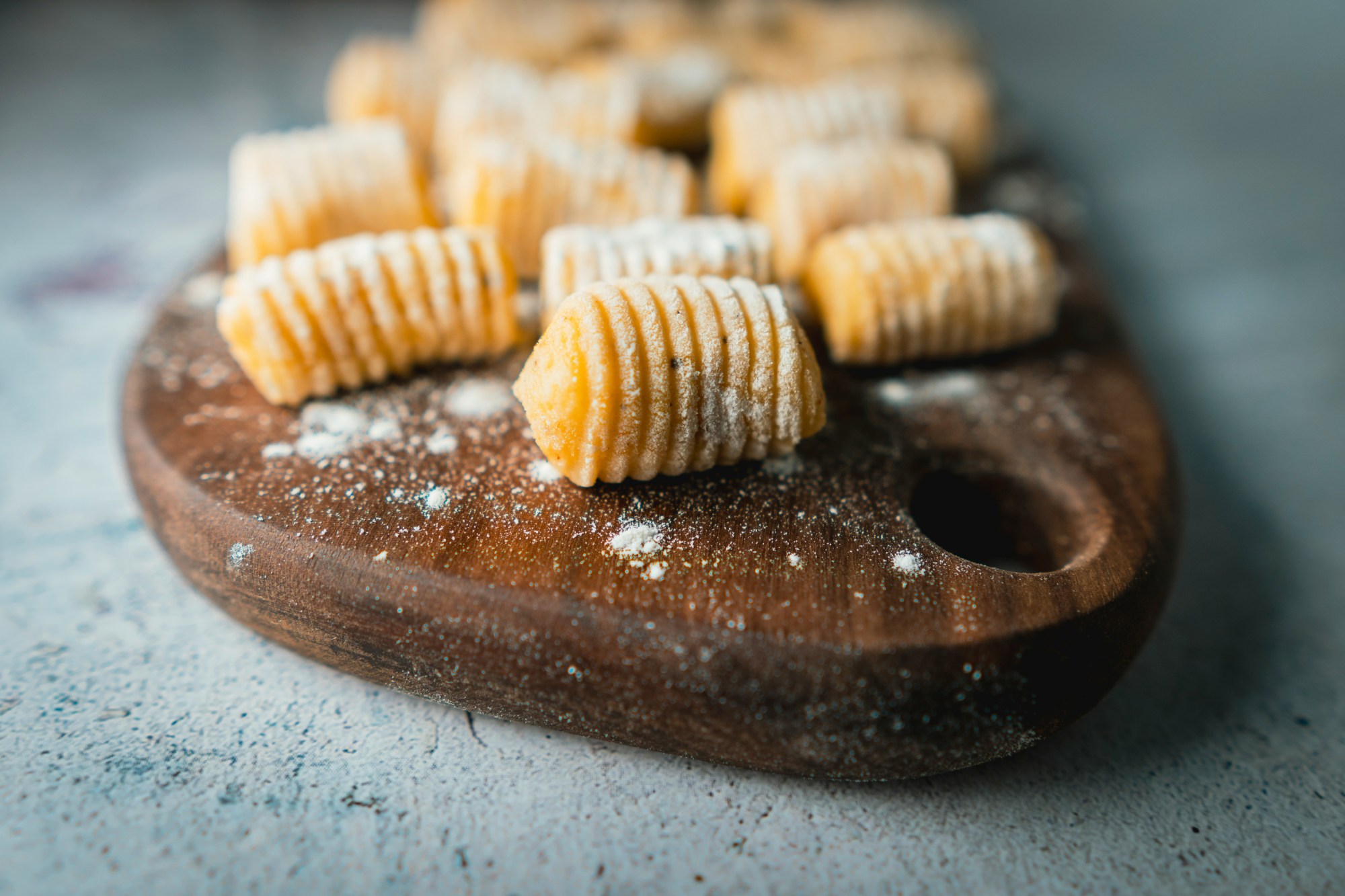 max-nayman-ovkAPHAdbBM-unsplash a close up of freshly made gnocchi