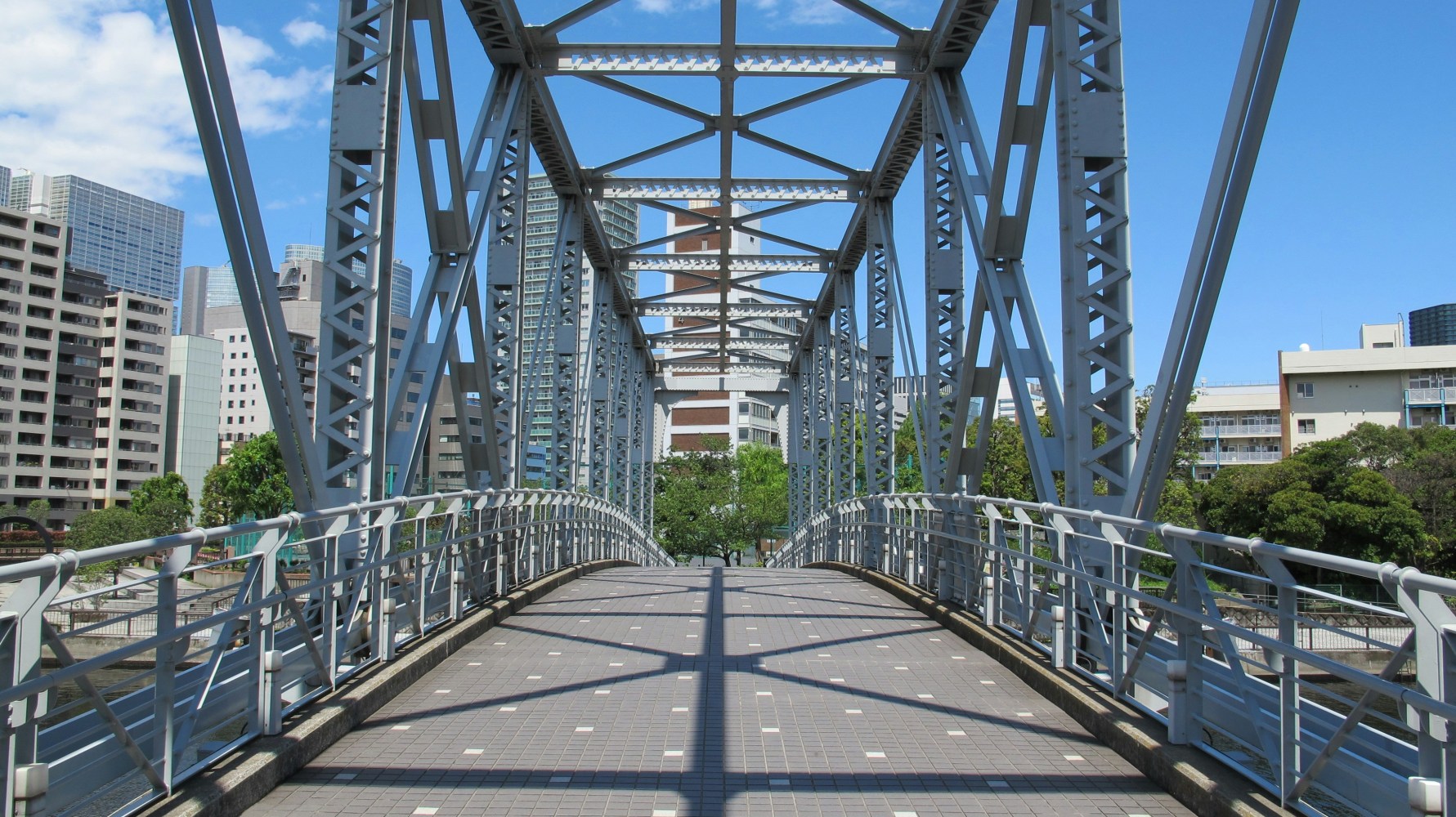 a bridge over a metal fence